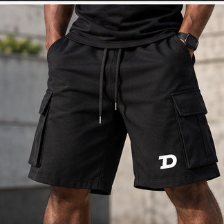 Model wearing The Don Unisex Drawstring Cargo Shorts